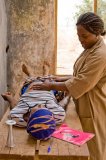 BMC Public Health nurse Agnes Nayina Mahama examines a pregnant woman at a mobile clinic in the Kokomba village of Gbangu-Nagbo, Ghana.