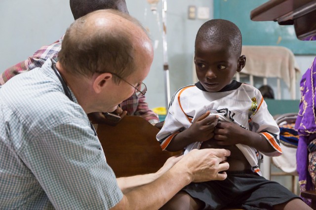 Dr. Jan Sunde checks up on a child at BMC.